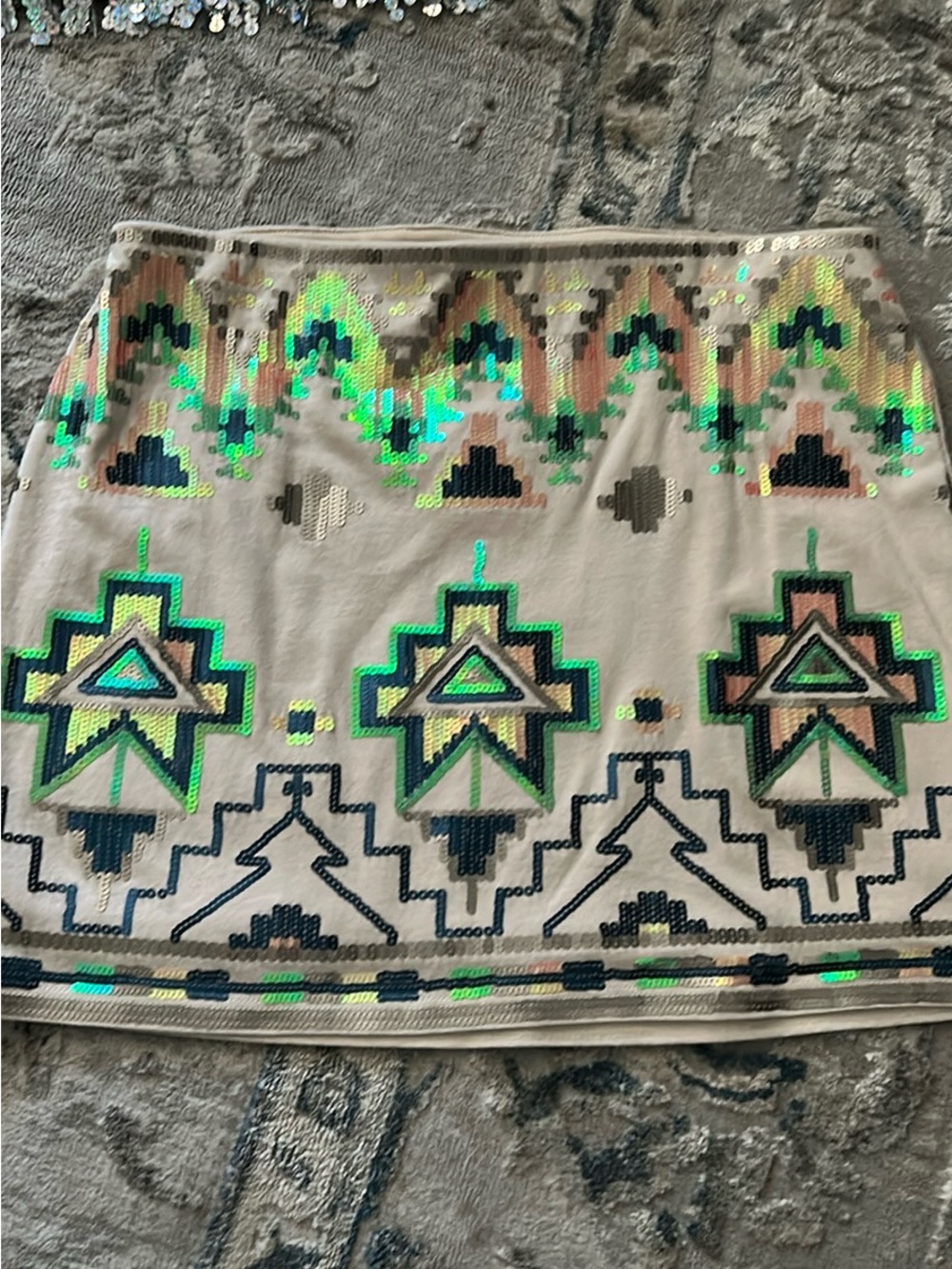 Express mini skirt features a vibrant multicolored Aztec
